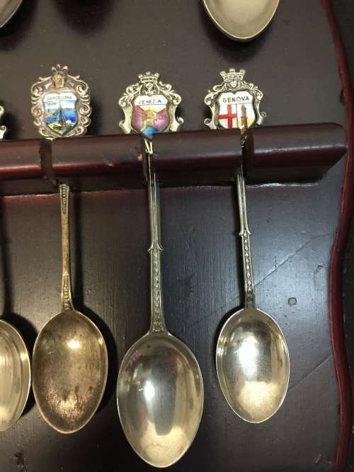 Nice wooden house spoon holder with collectable spoons. All For 1 Bid.