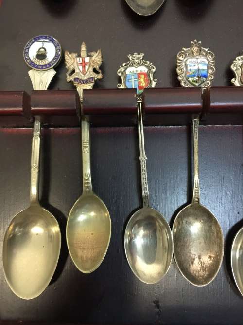 Nice wooden house spoon holder with collectable spoons. All For 1 Bid.