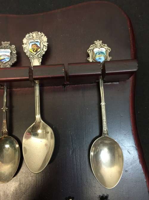 Nice wooden house spoon holder with collectable spoons. All For 1 Bid.