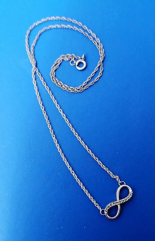 Silver chain and infinity pendant with diamonds###