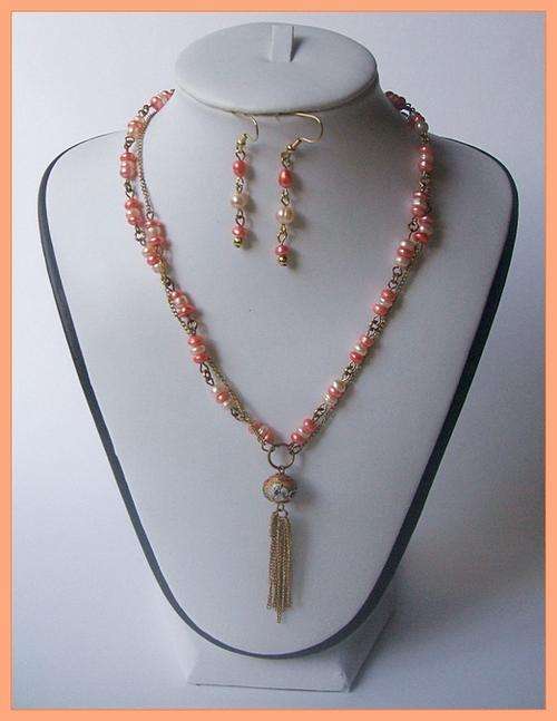 Genuine two strand peach and salmon freshwater pearl necklace, free earrings!