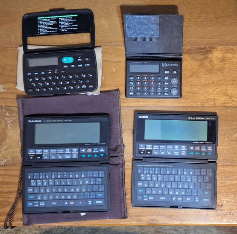 Collection of four vintage digital organisers