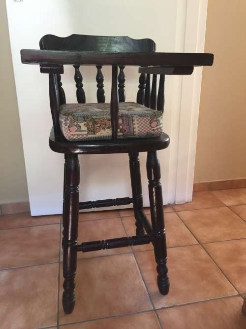 Wooden high chair with cushion