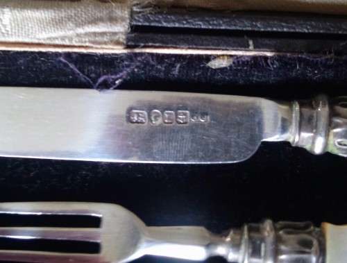 Hallmarked silver child's knife and fork set.