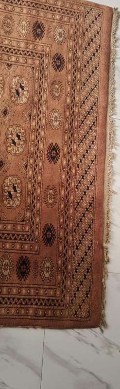 Slightly worn Persian carpet