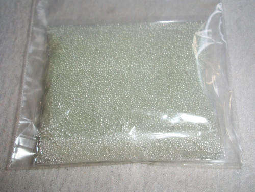 Tiny glass beads for adding weight to bears and dolls.