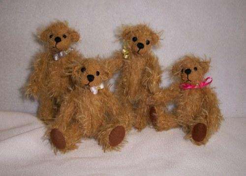 Miniature mohair bear,10 cm with white bow.