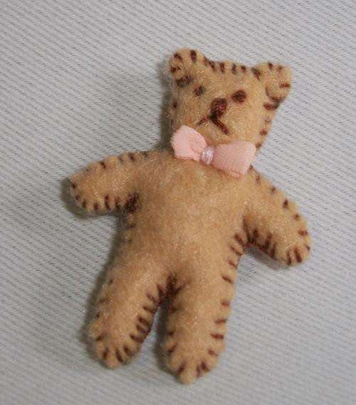 Tiny 3,5 cm felt teddy bear.