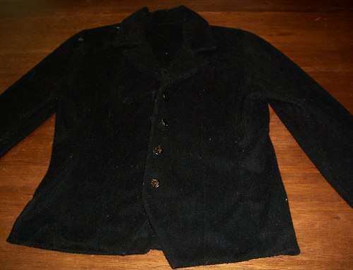 Black velvet type jacket for a size 32.
