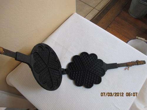 A very old and heavy cast iron Waffle maker!  Made by MUSTAD