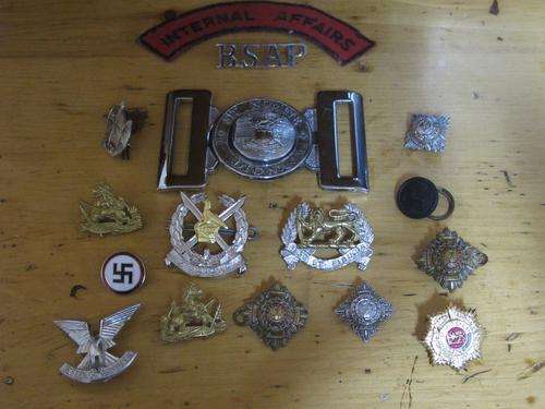 A wonderful selection of Rhodesian Badges, buttons, buckles and memorabilia.