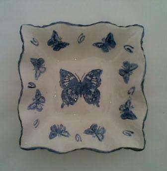 Square bowl - plate 12cm, and 2 cm high with fluted edges and depicting a butterflies