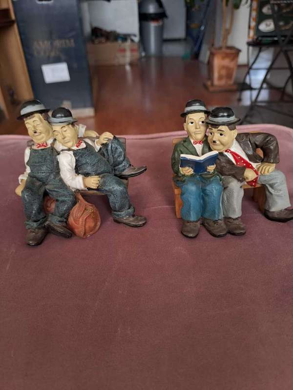 2 x Laurel and Hardy figurines, Reading and Sleeping
