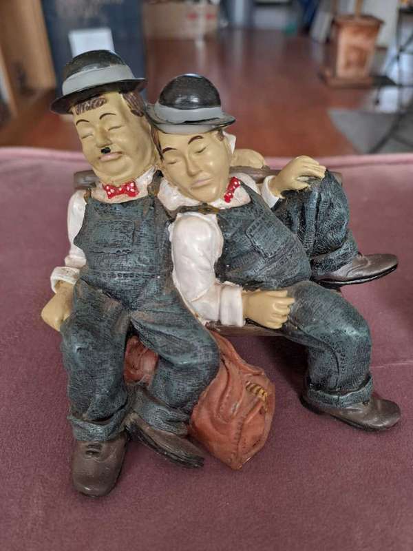 2 x Laurel and Hardy figurines, Reading and Sleeping