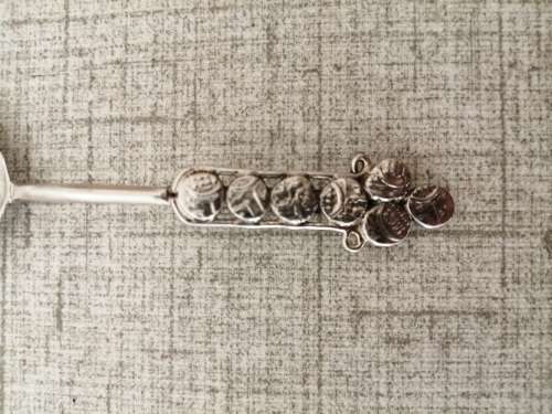 Dainty, short handled sugar teaspoon