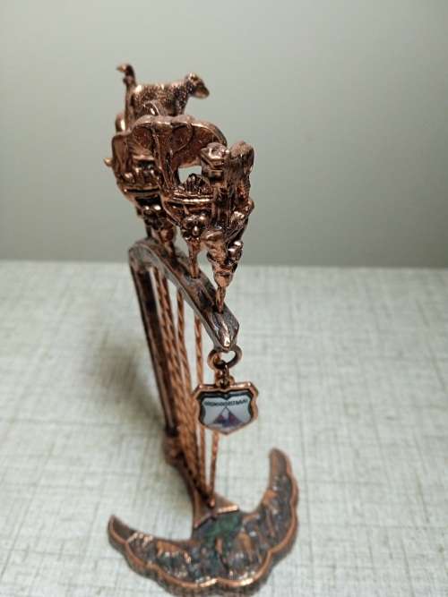 Copper olive sticks on stand