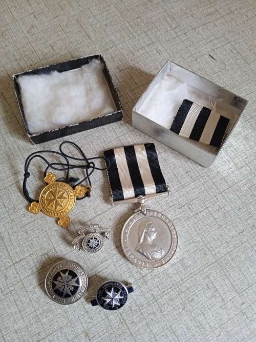 St Johns Victoria Brit long service medal and some st Johns badges and pins