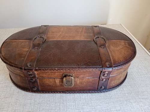 Small wooden suitcase, covered in leather