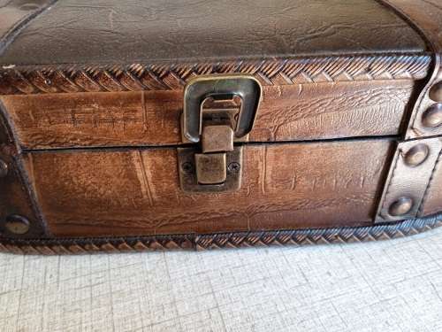 Small wooden suitcase, covered in leather