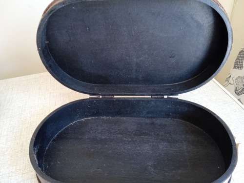 Small wooden suitcase, covered in leather