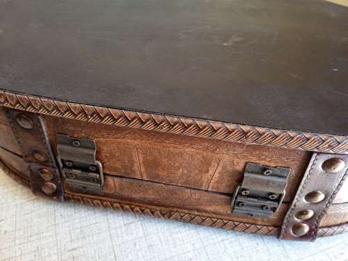 Small wooden suitcase, covered in leather