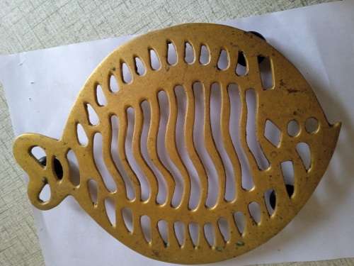 Brass trivet in the shape of a fish