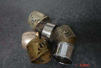 6 ODD SERVIETTE RINGS