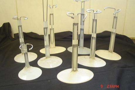 8 PORCELAIN DOLL STANDS