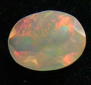 1.07ct 9x7mm Oval Red-Rainbow "Play Of Colour" Crystal OPAL, ETHIOPIA