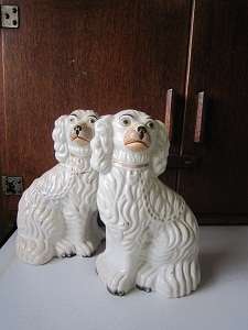 PAIR OF ANTIQUE STAFFORDSHIRE SPANIELS (ONE DAMAGED)