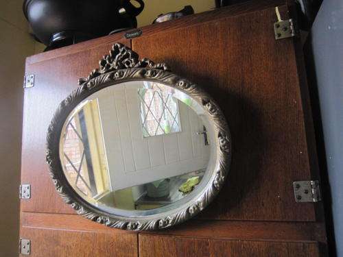 OVAL BEVILLED GLASS AND PAINTED GESSO MIRROR  ITEM NO 721
