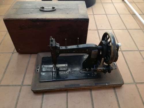 Antique sewing machine with box
