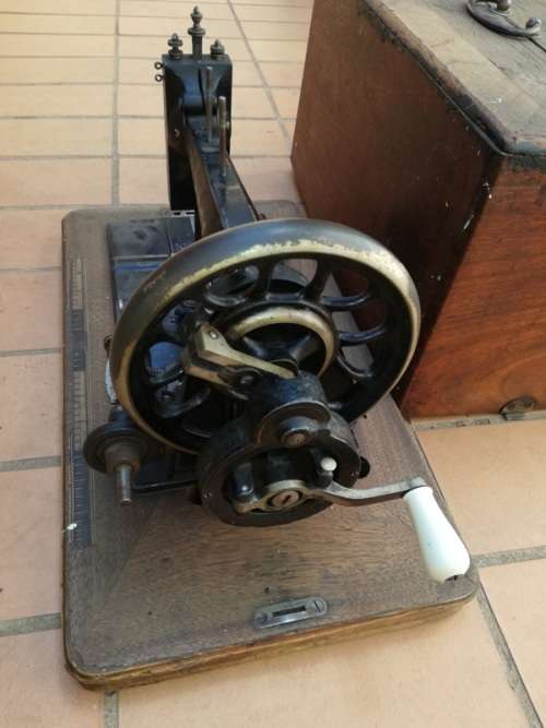 Antique sewing machine with box