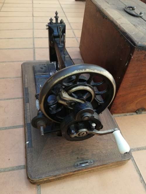Antique sewing machine with box