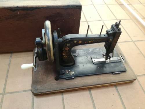 Antique sewing machine with box
