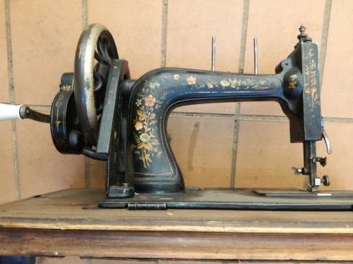 Antique sewing machine with box