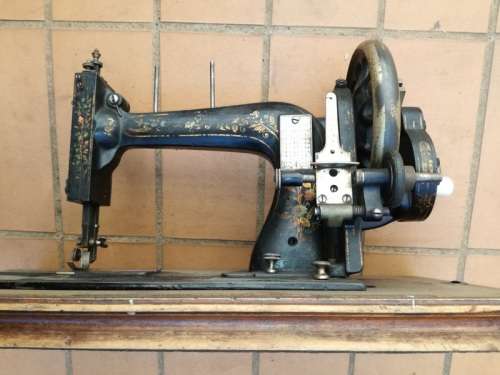 Antique sewing machine with box