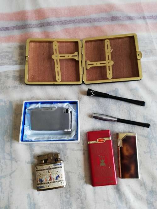 Assortment of tobacciana - lighters, cigarette holders and cigarette case