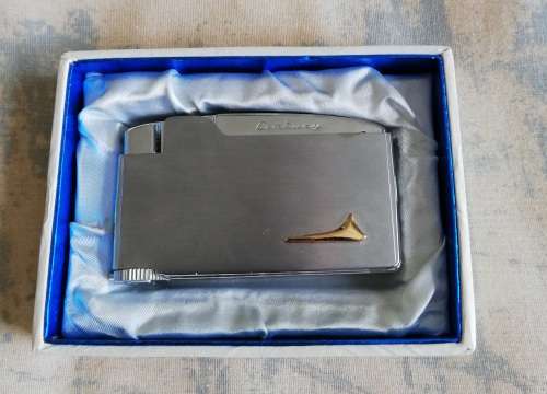 Assortment of tobacciana - lighters, cigarette holders and cigarette case
