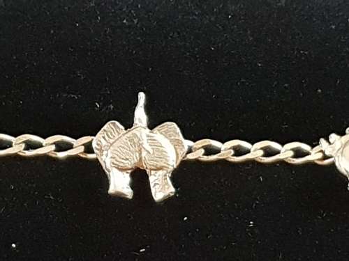 Unusual silver bracelet with the back end of the big 5 animals