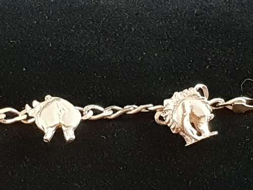 Unusual silver bracelet with the back end of the big 5 animals