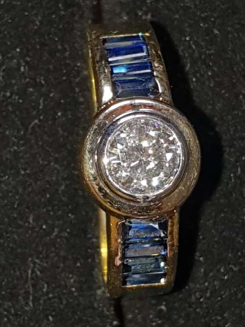 Genuine 18ct Saphire and .80 carat Diamond ring