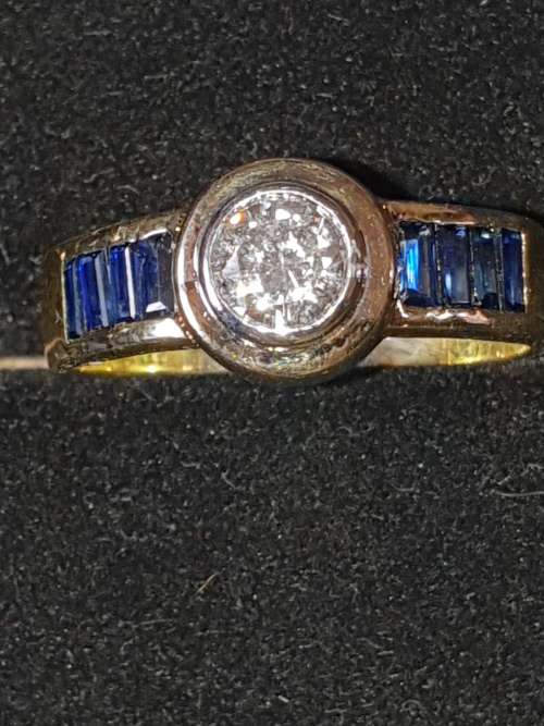 Genuine 18ct Saphire and .80 carat Diamond ring