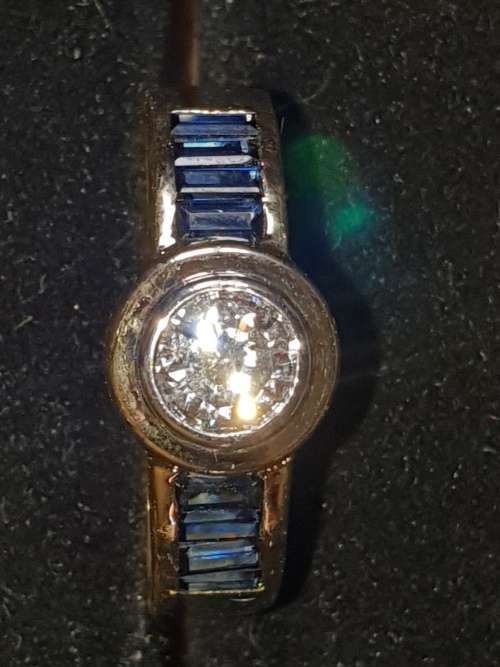 Genuine 18ct Saphire and .80 carat Diamond ring