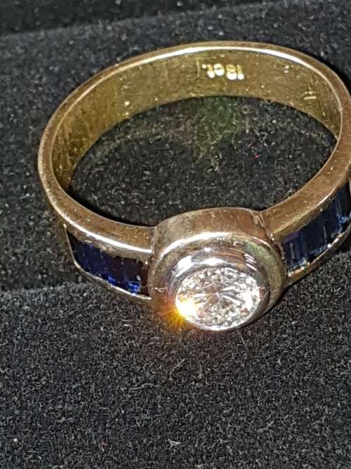 Genuine 18ct Saphire and .80 carat Diamond ring