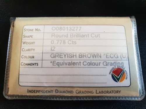 Round Briant cut large 0.778 carat greyish brown I2 Natural Diamond with I.D.L grading