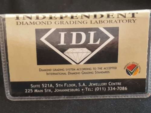 Round Briant cut large 0.778 carat greyish brown I2 Natural Diamond with I.D.L grading