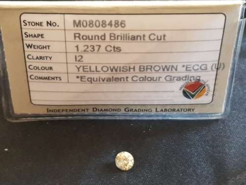 Round Brilliant cut Very large 1.237 carat I2 Yellowish brown Diamond