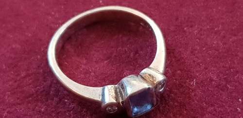 Genuine 9ct white gold ring with synthetic tanzanite and c.z`s
