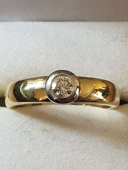 18ct yellow and white gold tube set  solitaire 0.34 carat diamond ring